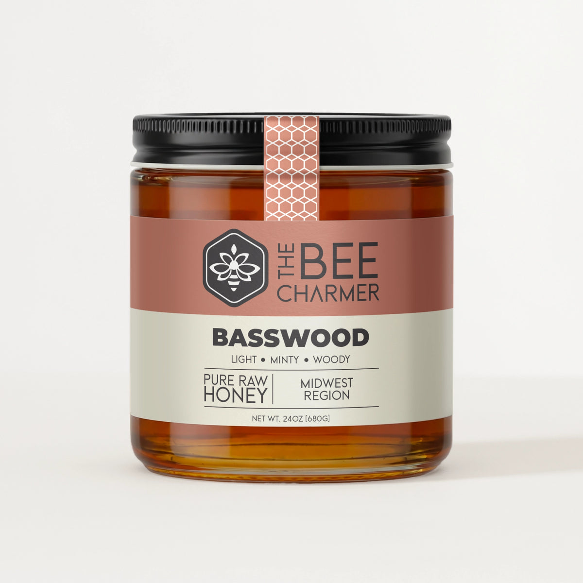 Pure raw Basswood Honey in a signature Bee Charmer branded 24oz wide-mouth glass jar.  This is our largest available size.