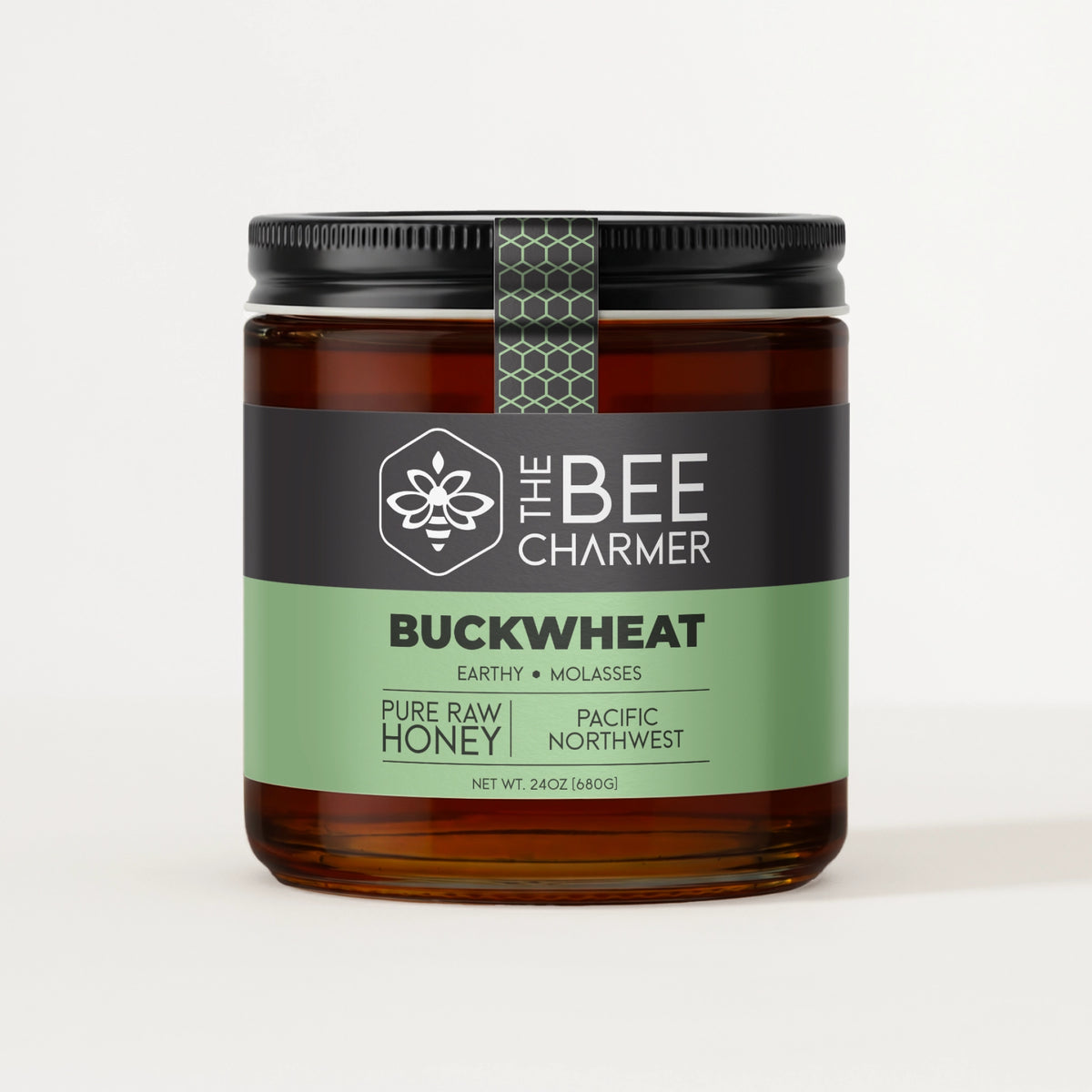 Pure raw Buckwheat Honey in a signature Bee Charmer branded 24oz wide-mouth glass jar.  This is our largest available size.