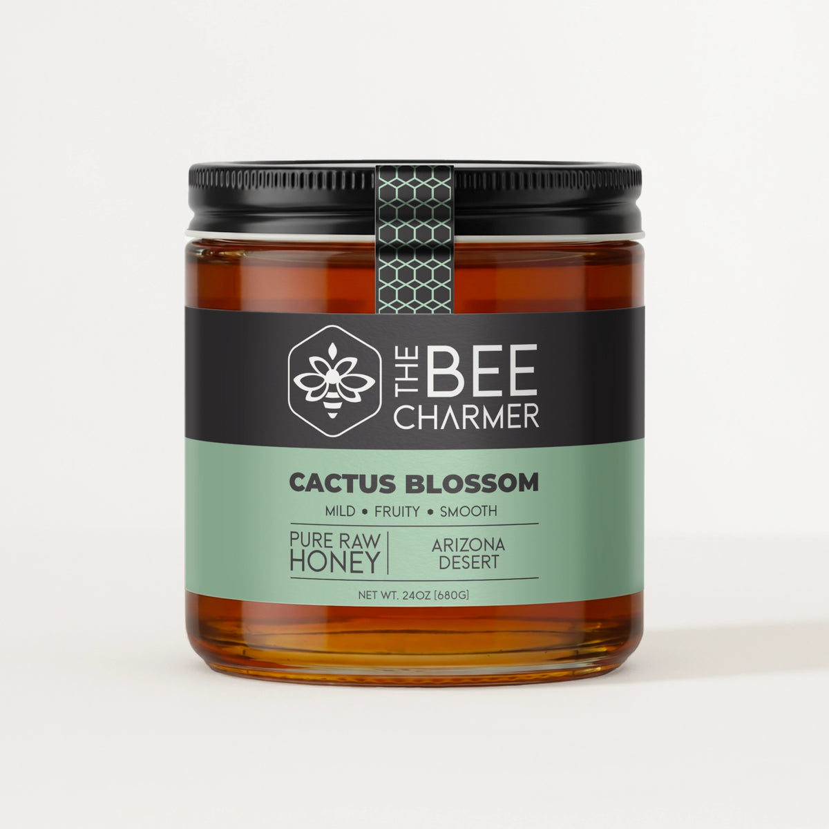 Pure raw Cactus Blossom Honey in a signature Bee Charmer branded 24oz wide-mouth glass jar.  This is our largest available size.