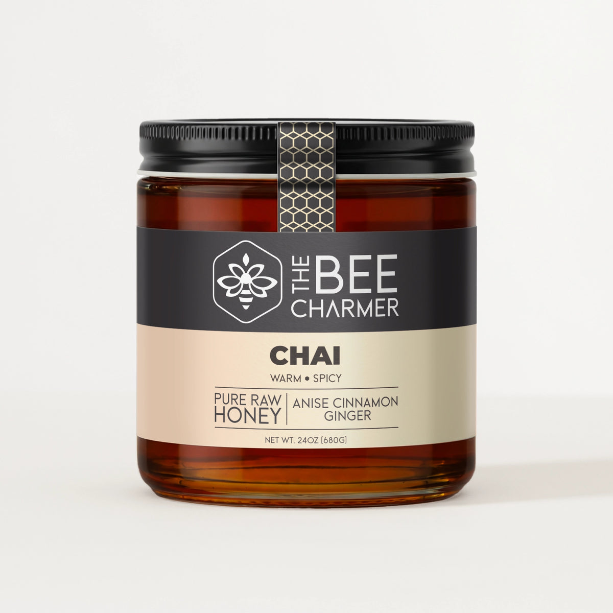 Anise Cinnamon Ginger-infused Chai Honey in a signature Bee Charmer branded 24oz wide-mouth glass jar.  This is our largest available size.