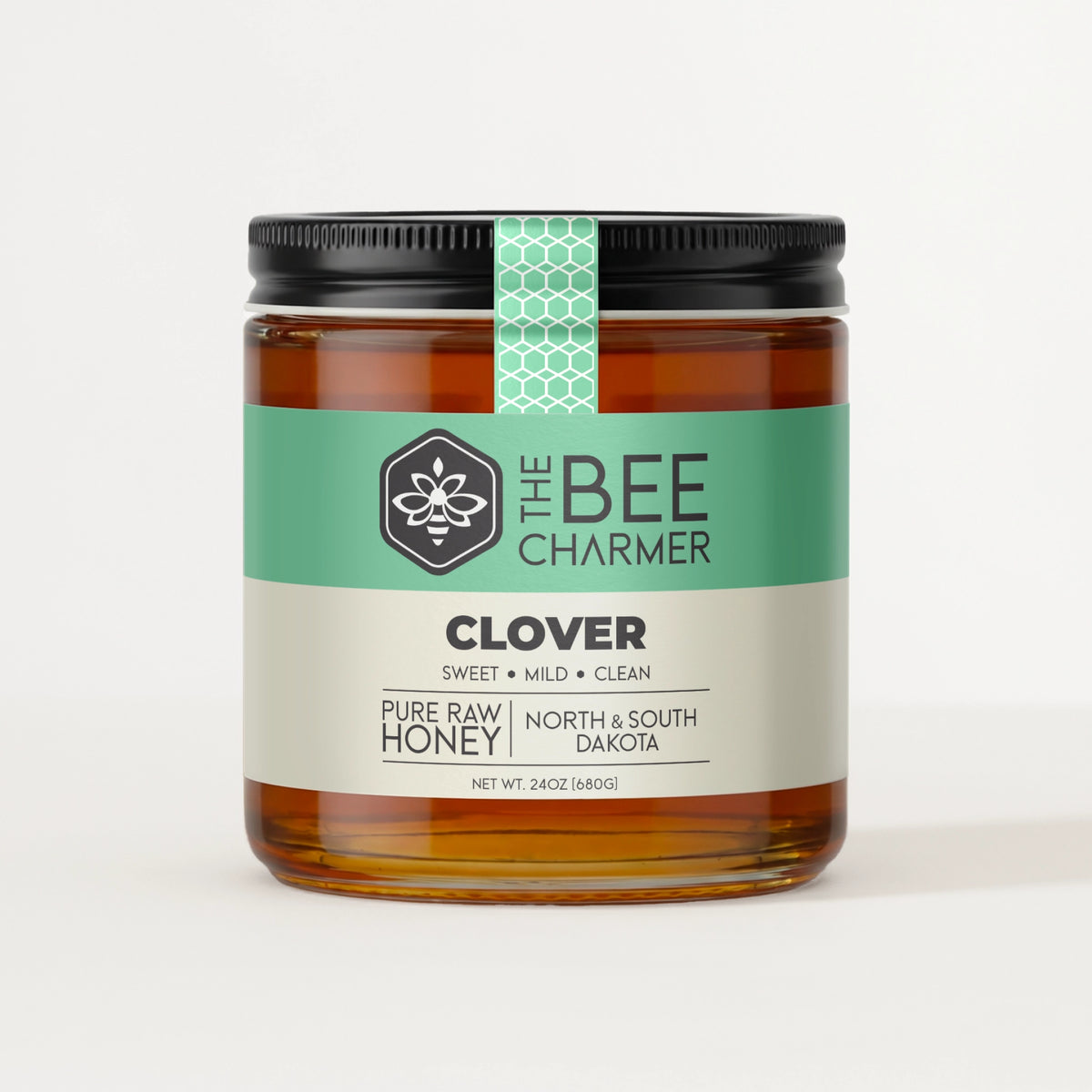 Pure raw Clover Honey in a signature Bee Charmer branded 24oz wide-mouth glass jar.  This is our largest available size.