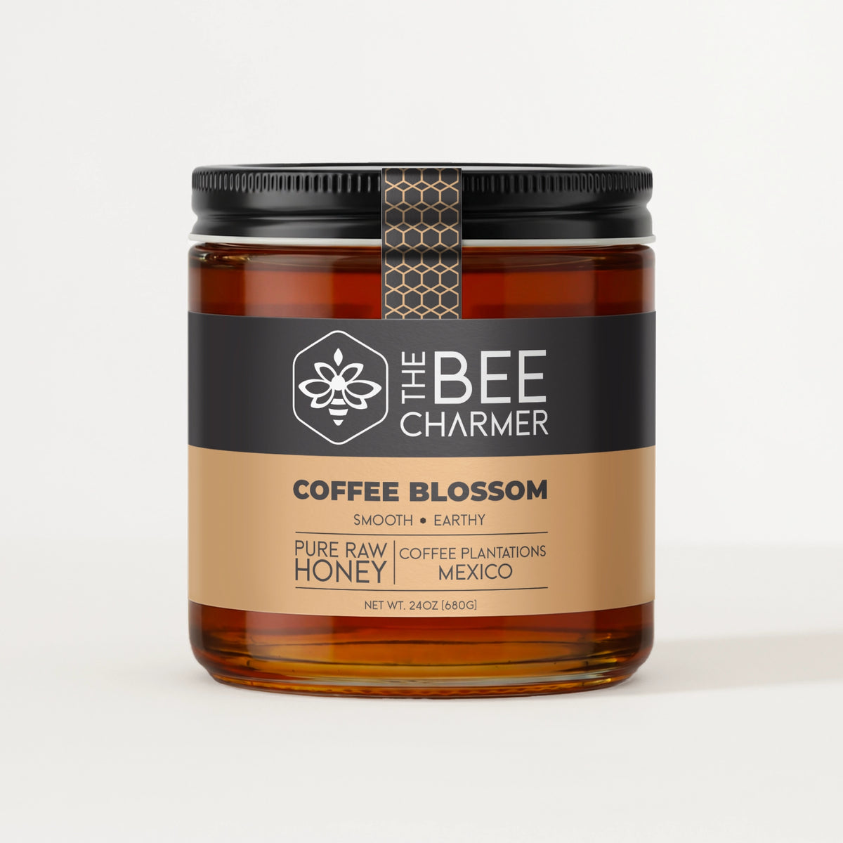Pure raw Coffee Blossom Honey in a signature Bee Charmer branded 24oz wide-mouth glass jar.  This is our largest available size.