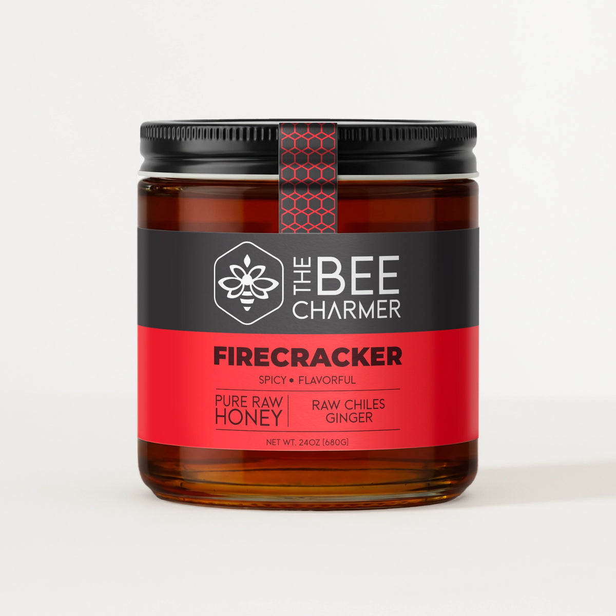 Chile and ginger-infused Firecracker Hot Honey in a signature Bee Charmer branded 24oz wide-mouth glass jar.  This is our largest available size.