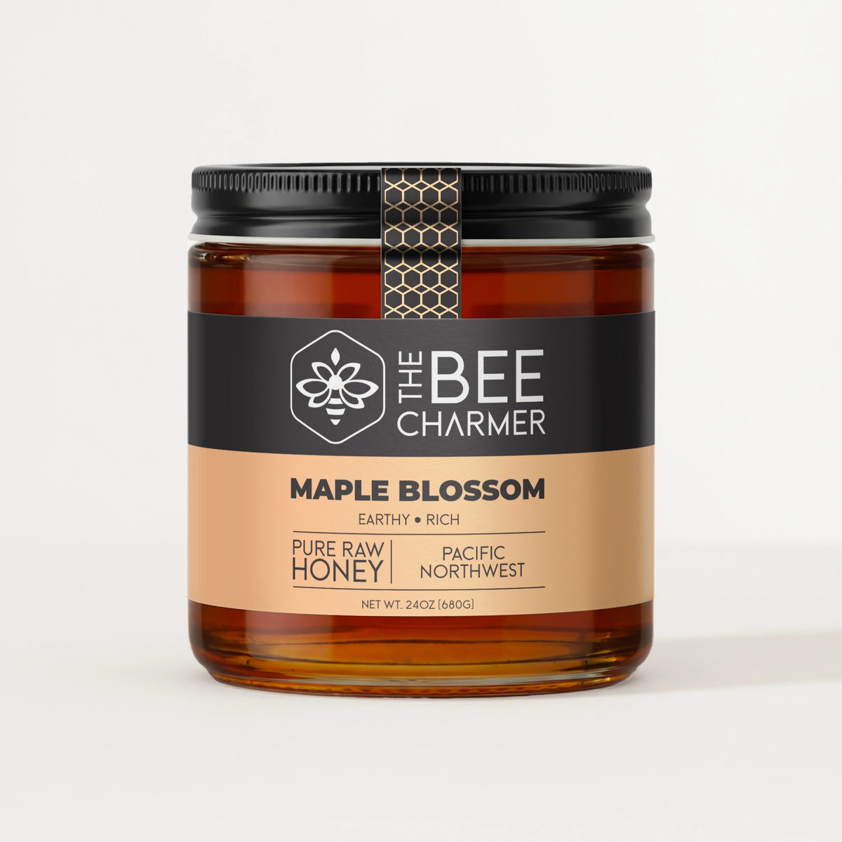 Pure raw Maple Blossom Honey in a signature Bee Charmer branded 24oz wide-mouth glass jar.  This is our largest available size.