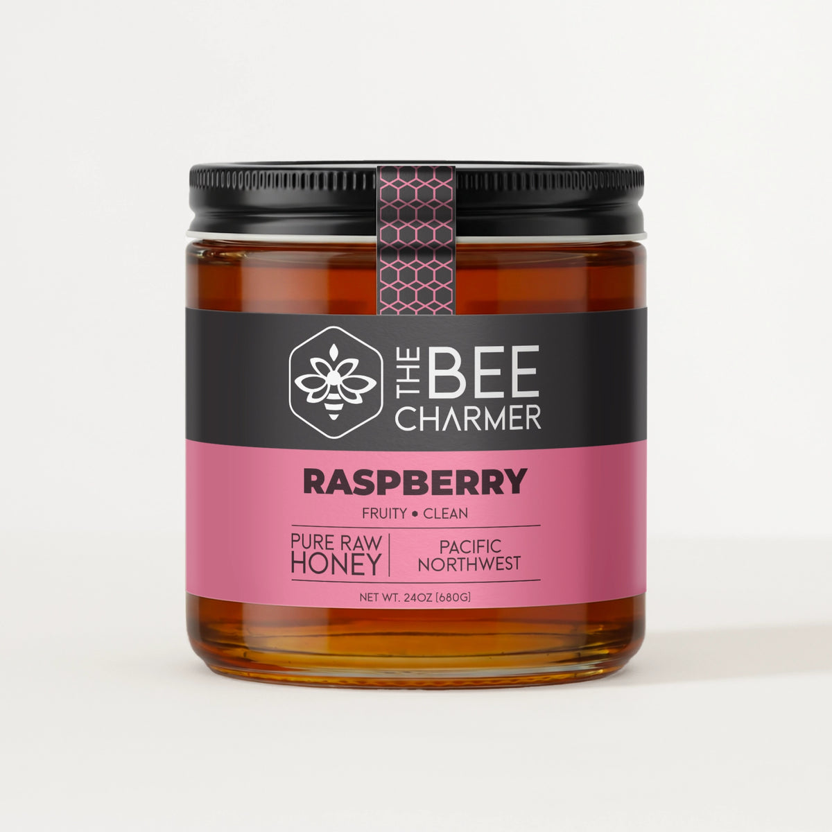 Pure raw Raspberry honey in a signature Bee Charmer branded 24oz wide-mouth glass jar.  This is our largest available size.