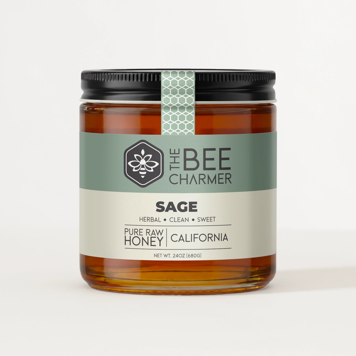 Pure raw Sage Honey in a signature Bee Charmer branded 24oz wide-mouth glass jar.  This is our largest available size.