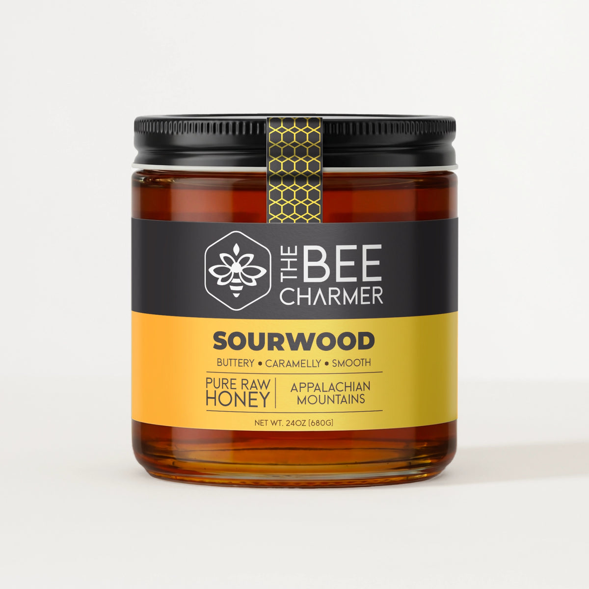 Raw Sourwood honey in a 24oz wide-mouth jar — harvested from Appalachian Mountain beekeepers by The Bee Charmer