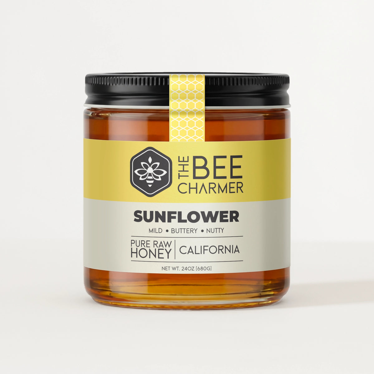 Pure raw Sunflower Honey in a signature Bee Charmer branded 24oz wide-mouth glass jar.  This is our largest available size.