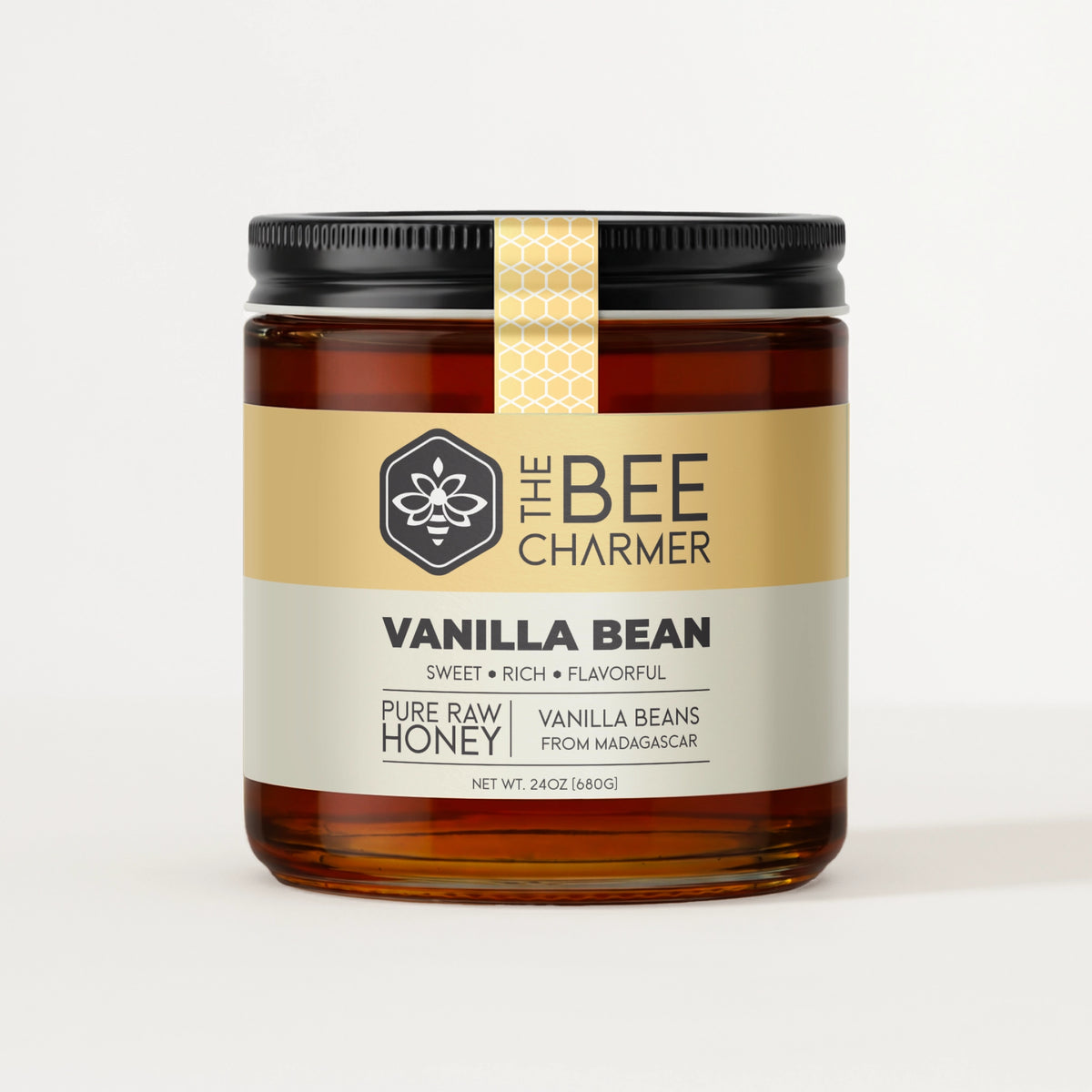 Vanilla Bean Honey in a signature Bee Charmer branded 24oz wide-mouth glass jar.  This is our largest available size.