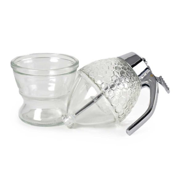 The Bee Charmer's glass honeycombed honey dispenser featuring the warming bottom.