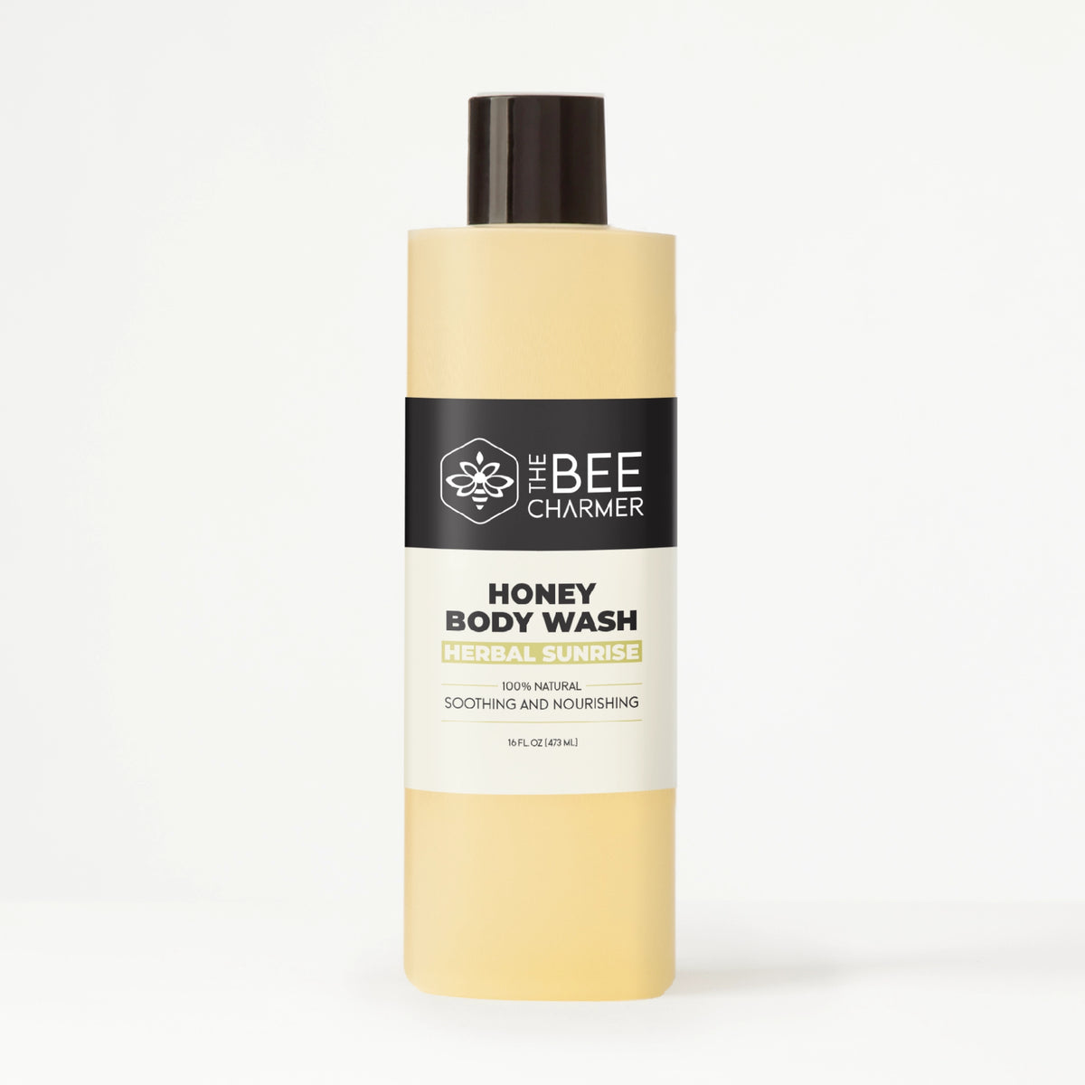 A 16 fl oz bottle of The Bee Charmer’s Herbal Sunrise scented Honey Body Wash.