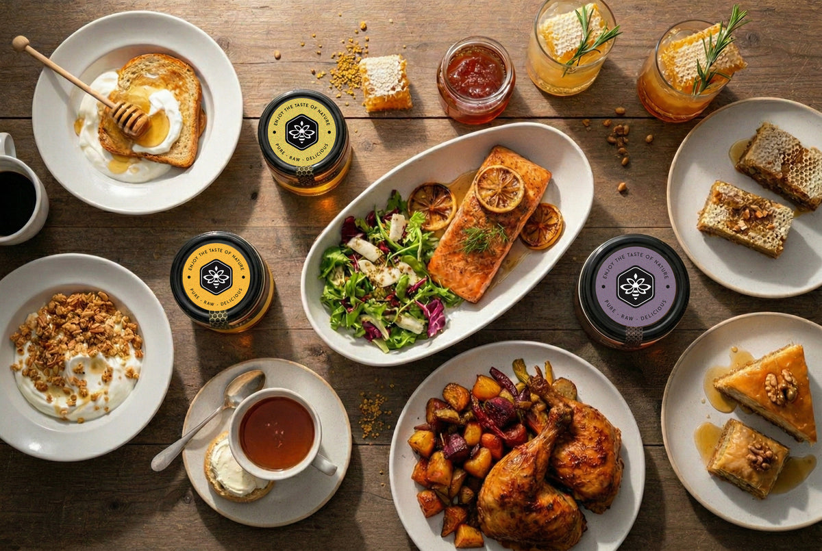 Assorted breakfast, brunch, and dinner food all prepared using The Bee Charmer's honey.  Food and honey jars shown on table. 
